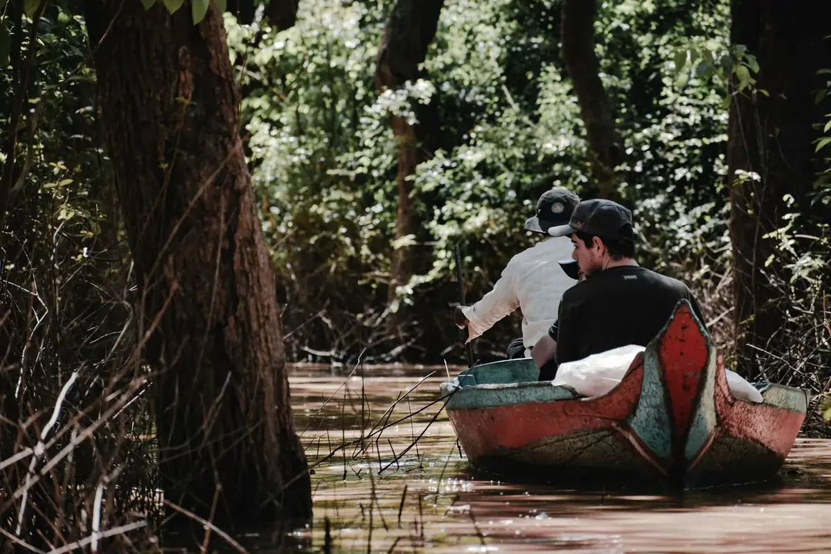 A boat through the flooded forest at Kampong Khleang