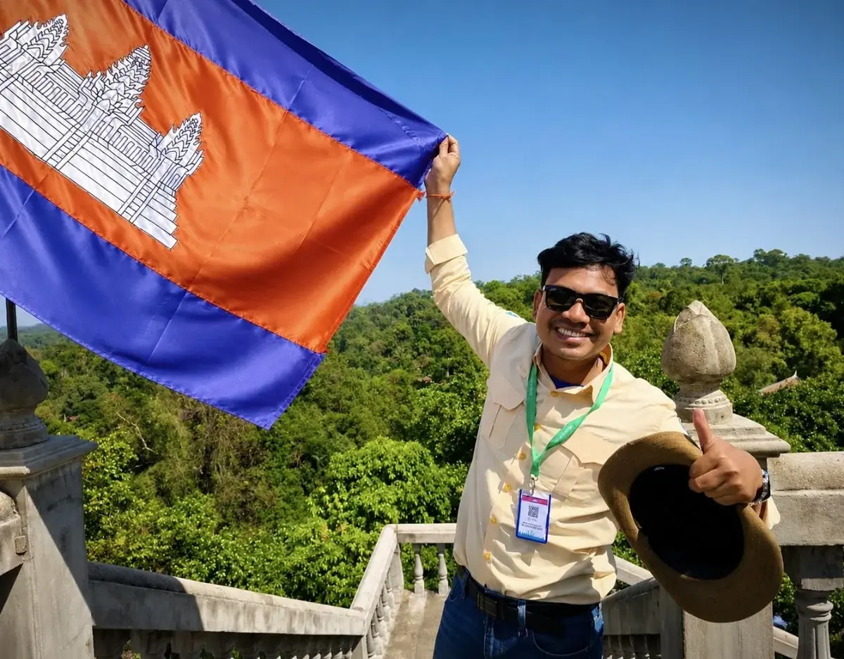 Sitha Roet, your Ministry-certified Siem Reap tour guide, with the Cambodian flag