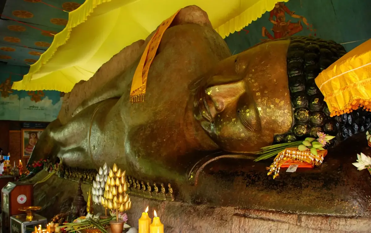 Preah Ang Thom, the 16th-century reclining Buddha carved into the summit rock